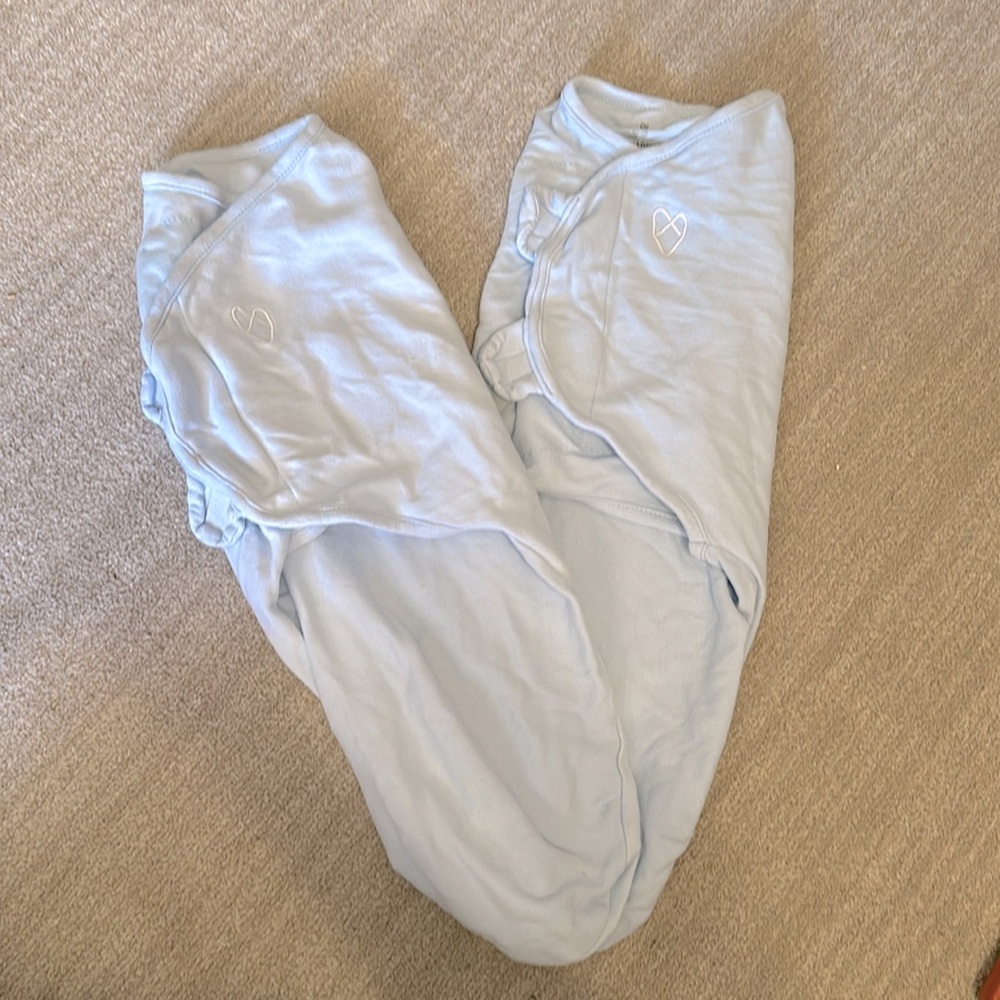 10 sleep sacks and swaddles ranging from small-medium to large. Various brands.